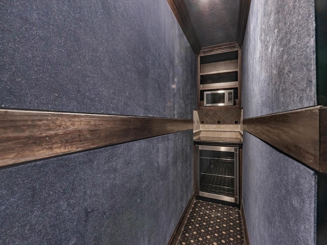 11938 Galentine Pt, Cypress, TX 77429 - stairs featuring wine cooler
