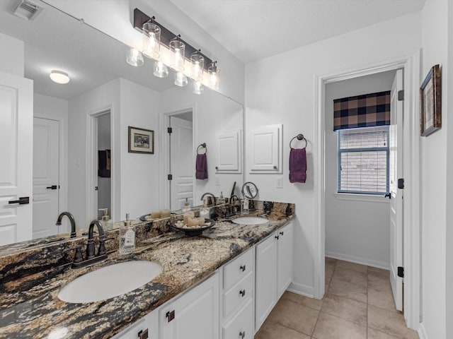 11938 Galentine Pt, Cypress, TX 77429 - full bath featuring double vanity and tile patterned flooring