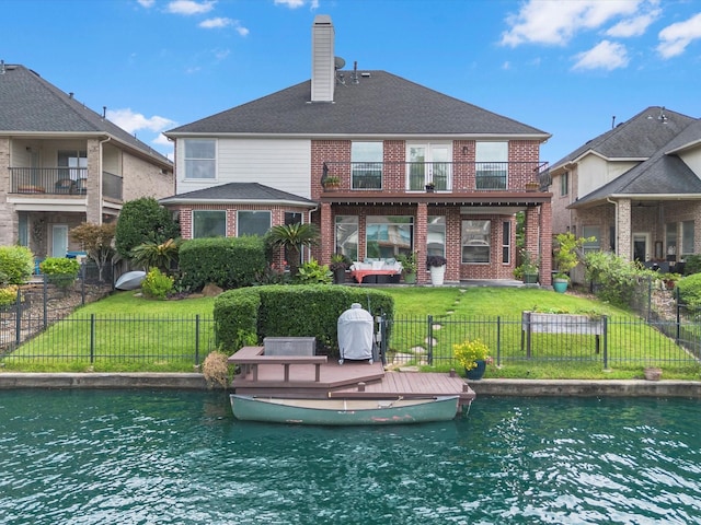 11938 Galentine Pt, Cypress, TX 77429 - rear view of house featuring brick siding, a balcony, and a chimney