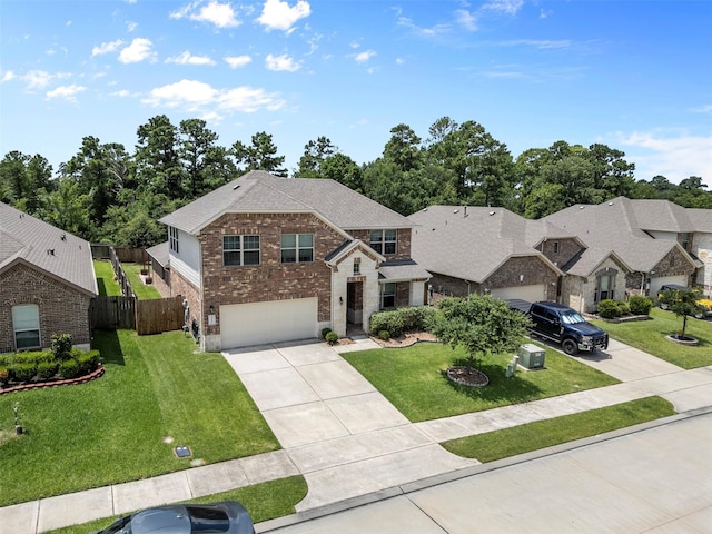 12137 Pearl Bay Ln, Conroe, TX 77304 - view of front facade with driveway, brick siding, a garage, and a shingled roof