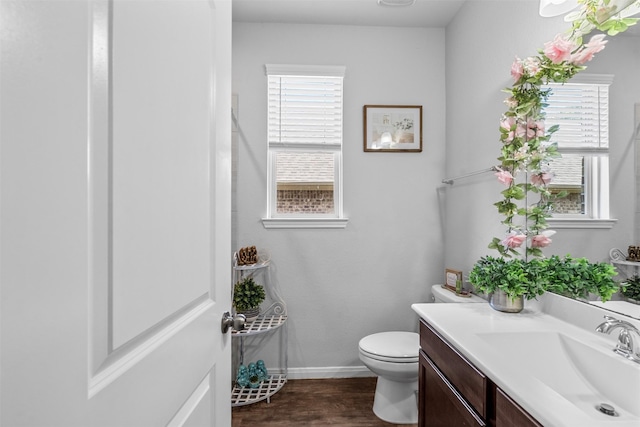 12137 Pearl Bay Ln, Conroe, TX 77304 - bathroom with vanity, wood finished floors, and healthy amount of natural light