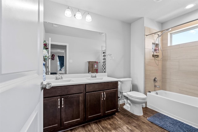 12137 Pearl Bay Ln, Conroe, TX 77304 - full bath with double vanity, wood finished floors, and bathing tub / shower combination