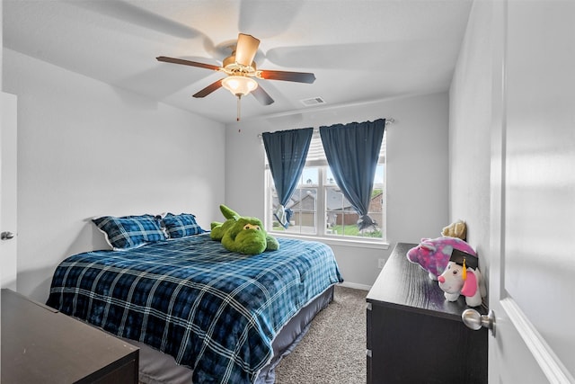 12137 Pearl Bay Ln, Conroe, TX 77304 - carpeted bedroom with a ceiling fan and baseboards