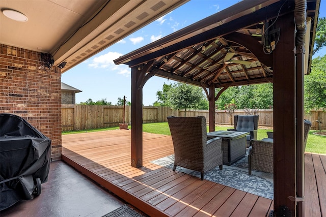 12137 Pearl Bay Ln, Conroe, TX 77304 - wooden deck with outdoor lounge area, a fenced backyard, a gazebo, and area for grilling