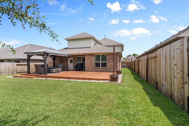 12137 Pearl Bay Ln, Conroe, TX 77304 - rear view of house featuring a gazebo, a fenced backyard, a shingled roof, and brick siding
