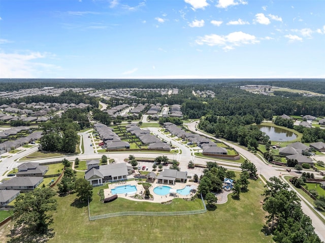 12137 Pearl Bay Ln, Conroe, TX 77304 - aerial view of residential area featuring a large body of water and a pool area