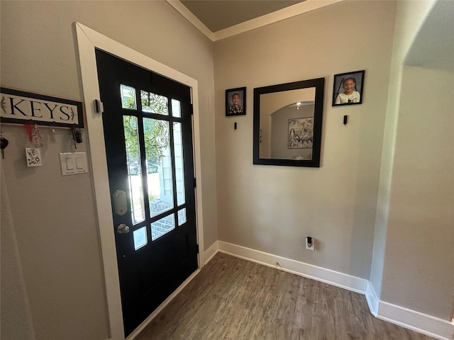 23918 Overcup Dr, Spring, TX 77389 - entryway with wood finished floors, crown molding, and arched walkways