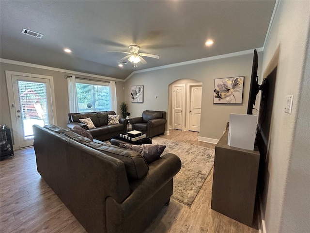 23918 Overcup Dr, Spring, TX 77389 - living area with ornamental molding, arched walkways, ceiling fan, wood finished floors, and recessed lighting