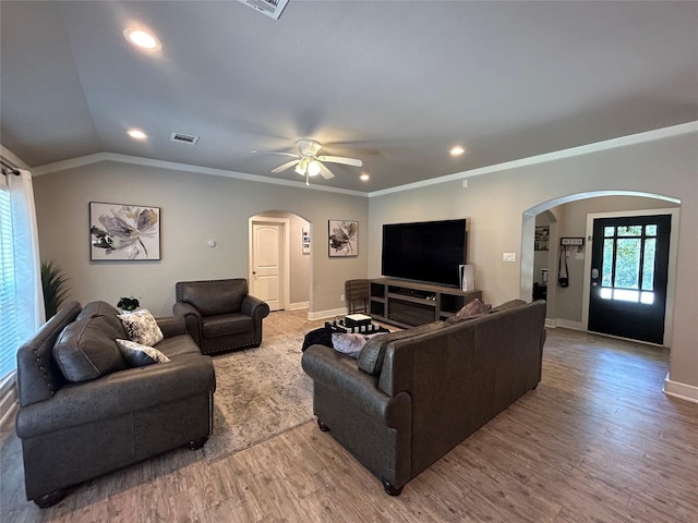 23918 Overcup Dr, Spring, TX 77389 - living room featuring arched walkways, wood finished floors, ceiling fan, recessed lighting, and ornamental molding