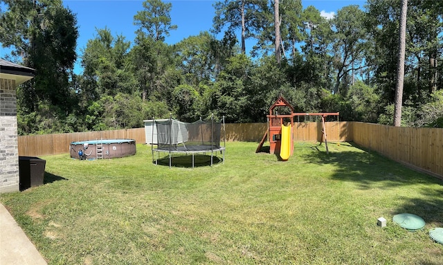 23918 Overcup Dr, Spring, TX 77389 - fenced backyard with a trampoline and a playground