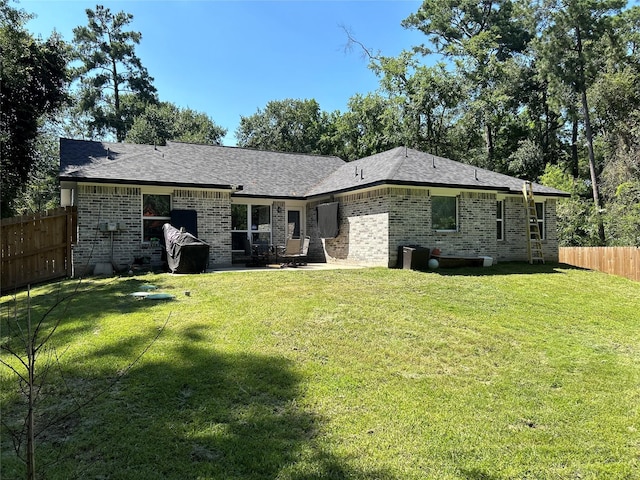 23918 Overcup Dr, Spring, TX 77389 - back of house featuring brick siding and a patio