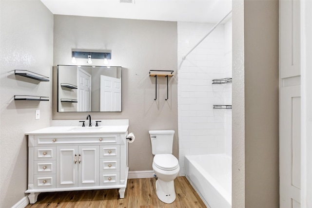 24824 W Christine Dr, Splendora, TX 77372 - full bathroom featuring wood finished floors, vanity, and shower / washtub combination