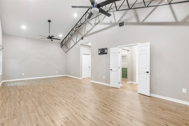 24824 W Christine Dr, Splendora, TX 77372 - unfurnished living room featuring a ceiling fan, light wood-style flooring, and recessed lighting