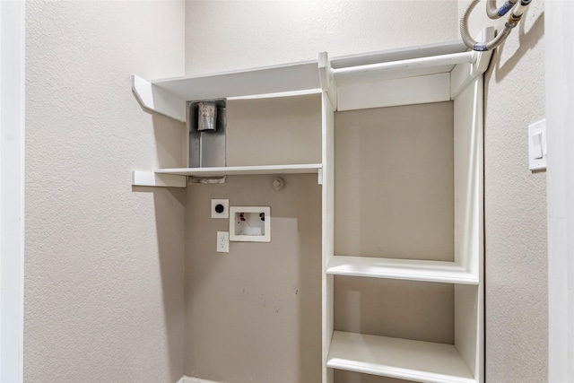 24824 W Christine Dr, Splendora, TX 77372 - laundry area featuring electric dryer hookup, hookup for a washing machine, and a textured wall