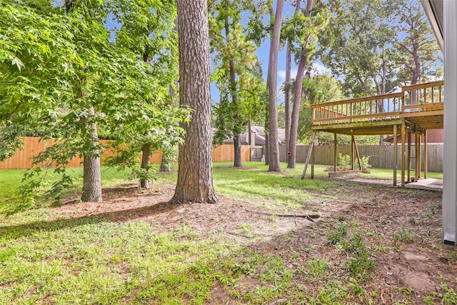 3203 Sycamore Springs Dr, Kingwood, TX 77339 - fenced backyard featuring a wooden deck