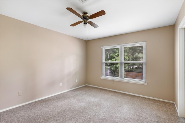 3203 Sycamore Springs Dr, Kingwood, TX 77339 - carpeted spare room with baseboards and a ceiling fan