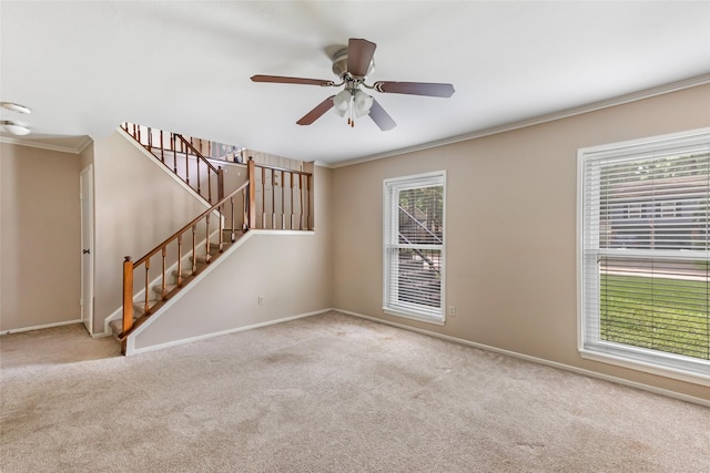 3203 Sycamore Springs Dr, Kingwood, TX 77339 - carpeted empty room featuring ornamental molding, a ceiling fan, and stairway