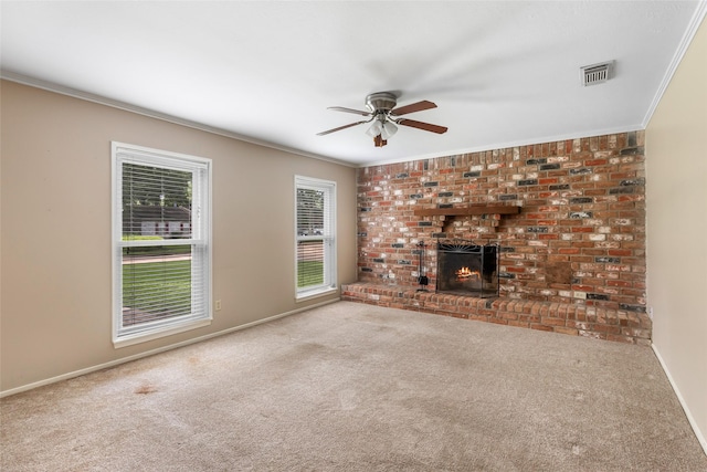 3203 Sycamore Springs Dr, Kingwood, TX 77339 - unfurnished living room with ornamental molding, carpet flooring, a ceiling fan, and a brick fireplace