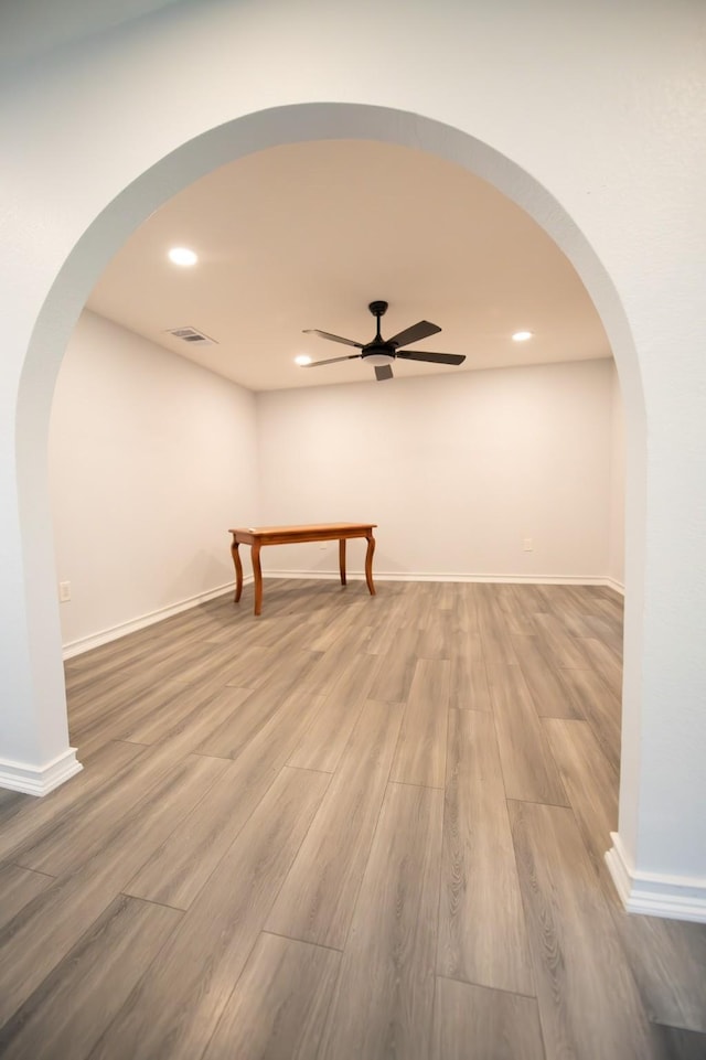 17106 Spring Creek Forest Dr, Spring, TX 77379 - spare room featuring a ceiling fan, wood finished floors, recessed lighting, and arched walkways
