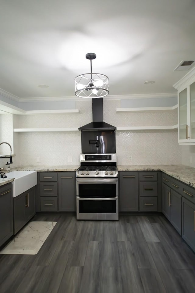 17106 Spring Creek Forest Dr, Spring, TX 77379 - kitchen with double oven range, wall chimney exhaust hood, open shelves, tasteful backsplash, and gray cabinets