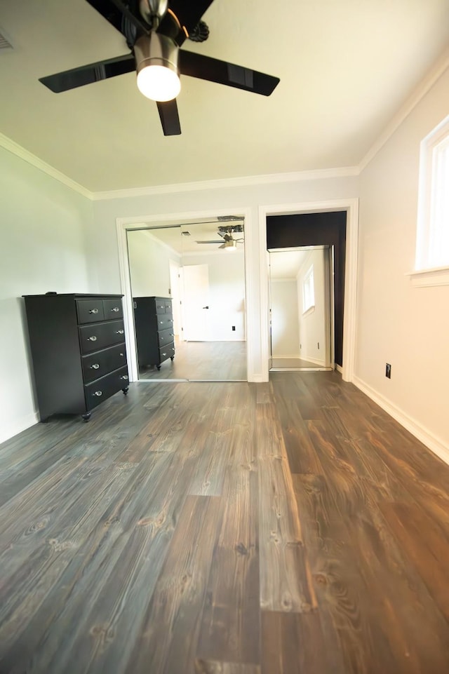 17106 Spring Creek Forest Dr, Spring, TX 77379 - unfurnished bedroom with dark wood finished floors, crown molding, ceiling fan, and a closet