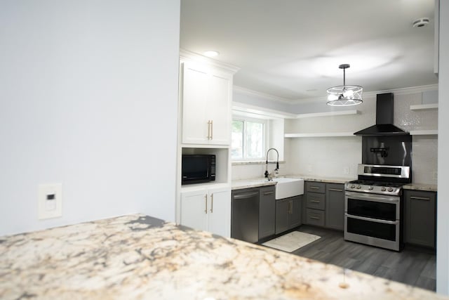 17106 Spring Creek Forest Dr, Spring, TX 77379 - kitchen with wall chimney range hood, stainless steel appliances, dark wood finished floors, light stone countertops, and open shelves