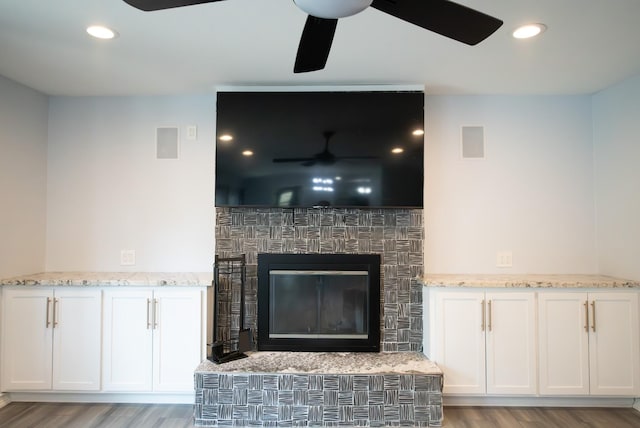17106 Spring Creek Forest Dr, Spring, TX 77379 - detailed view of ceiling fan, a glass covered fireplace, wood finished floors, and recessed lighting