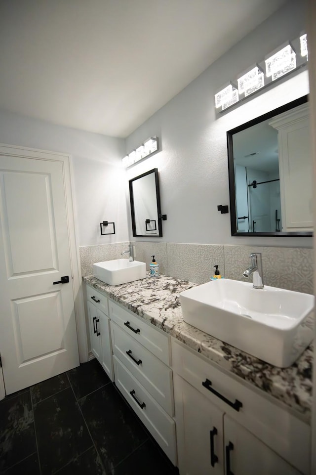 17106 Spring Creek Forest Dr, Spring, TX 77379 - full bath featuring double vanity, tile patterned floors, and tile walls