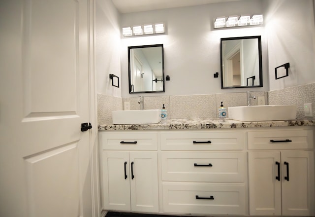 17106 Spring Creek Forest Dr, Spring, TX 77379 - bathroom with double vanity and backsplash