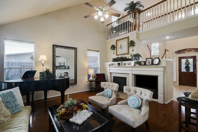 4714 Schiller Park Ln, Sugar Land, TX 77479 - living area with a fireplace, high vaulted ceiling, a ceiling fan, and wood finished floors