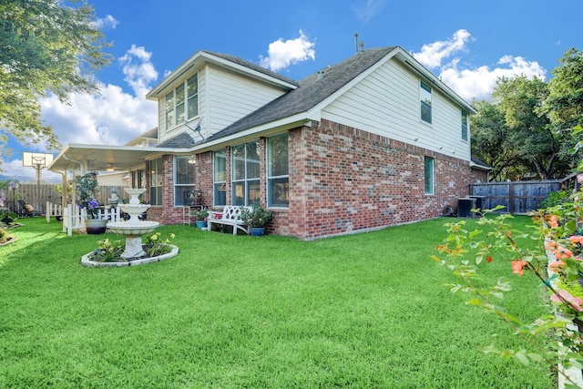 4714 Schiller Park Ln, Sugar Land, TX 77479 - rear view of property featuring brick siding, roof with shingles, and a sunroom