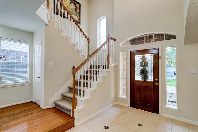 4714 Schiller Park Ln, Sugar Land, TX 77479 - foyer featuring stairway and a towering ceiling