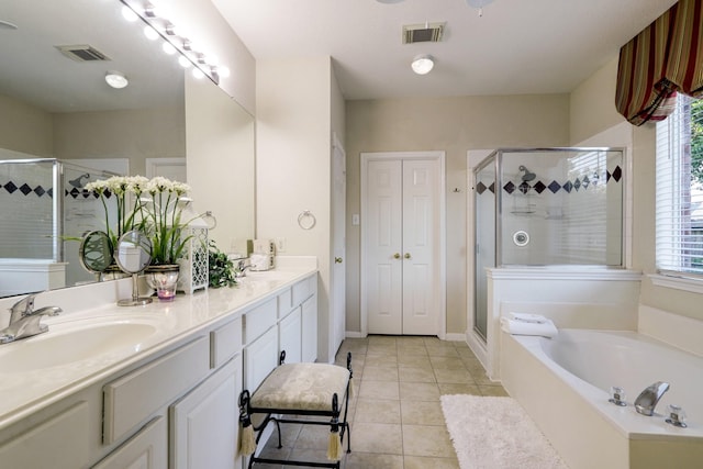 4714 Schiller Park Ln, Sugar Land, TX 77479 - full bathroom with double vanity, a shower stall, a bath, and tile patterned flooring
