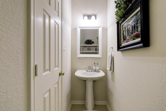 4714 Schiller Park Ln, Sugar Land, TX 77479 - bathroom featuring tile patterned floors and a sink