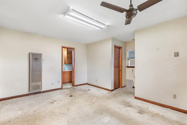 7202 Pinetex Dr, Houston, TX 77396 - empty room featuring a heating unit, unfinished concrete floors, and ceiling fan