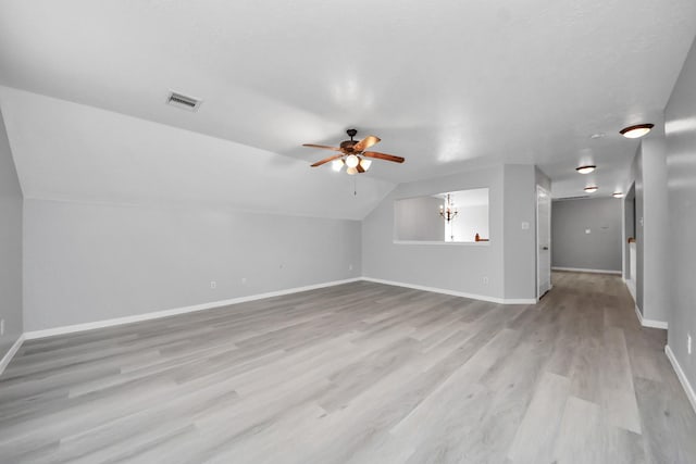6803 Chapelfield Ln, Houston, TX 77049 - unfurnished living room with a ceiling fan, wood finished floors, lofted ceiling, and a chandelier