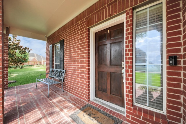 6803 Chapelfield Ln, Houston, TX 77049 - doorway to property with a porch and brick siding