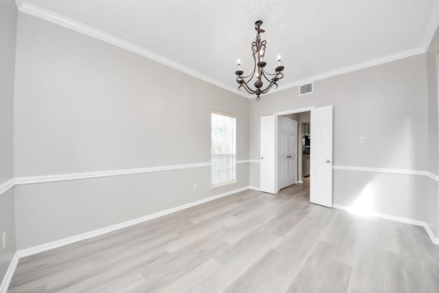6803 Chapelfield Ln, Houston, TX 77049 - spare room featuring a chandelier, crown molding, and light wood-style flooring