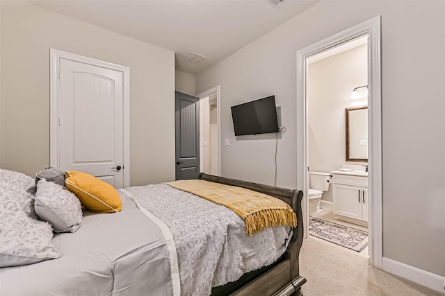 1939 Heather Canyon Dr, Pearland, TX 77089 - bedroom with light carpet and ensuite bathroom