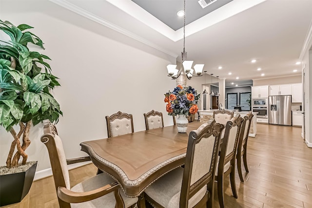 1939 Heather Canyon Dr, Pearland, TX 77089 - dining room with a chandelier, crown molding, light wood-style flooring, and recessed lighting