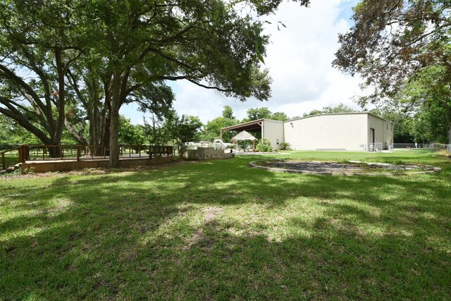 6709 Jay Rd, Hitchcock, TX 77563 - view of yard featuring a pole building and an outbuilding