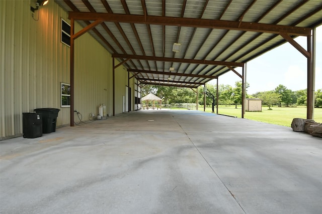 6709 Jay Rd, Hitchcock, TX 77563 - view of parking / parking lot with a shed, a carport, and concrete driveway