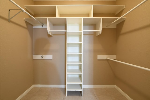 6709 Jay Rd, Hitchcock, TX 77563 - walk in closet featuring tile patterned flooring