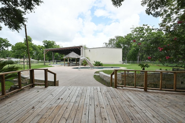 6709 Jay Rd, Hitchcock, TX 77563 - wooden deck with an outdoor pool, a fenced backyard, a patio, and a gazebo