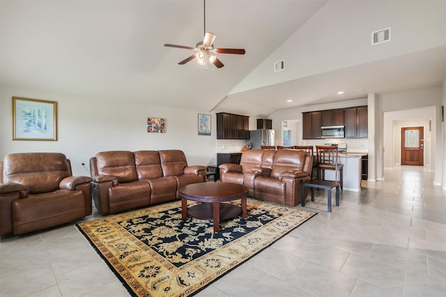 6914 Arcadia Meadow Ct, Richmond, TX 77407 - living room featuring a ceiling fan, light tile patterned floors, high vaulted ceiling, and recessed lighting