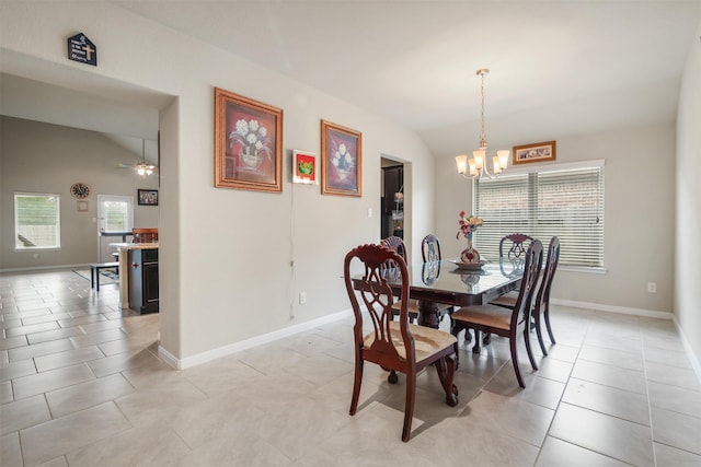 6914 Arcadia Meadow Ct, Richmond, TX 77407 - dining area with vaulted ceiling, a chandelier, a ceiling fan, and light tile patterned floors