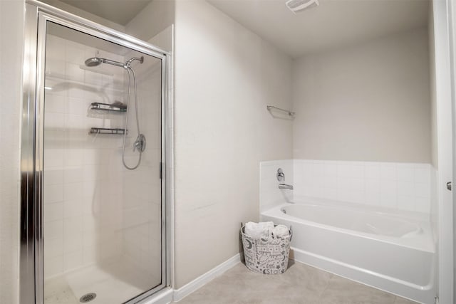 6914 Arcadia Meadow Ct, Richmond, TX 77407 - bathroom with a stall shower, a bath, and tile patterned flooring