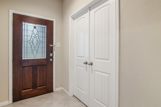 6914 Arcadia Meadow Ct, Richmond, TX 77407 - entryway with baseboards and light tile patterned floors
