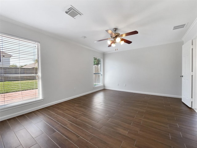 2317 Shady Pine Dr, Conroe, TX 77301 - empty room with a ceiling fan, crown molding, and dark wood-type flooring