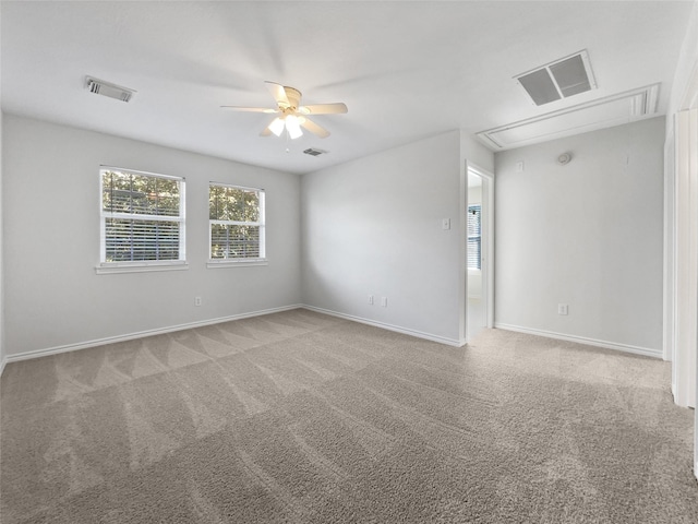 2317 Shady Pine Dr, Conroe, TX 77301 - carpeted spare room with attic access and ceiling fan